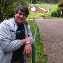 Picture of Pinaki in front of a garden in Mysore.